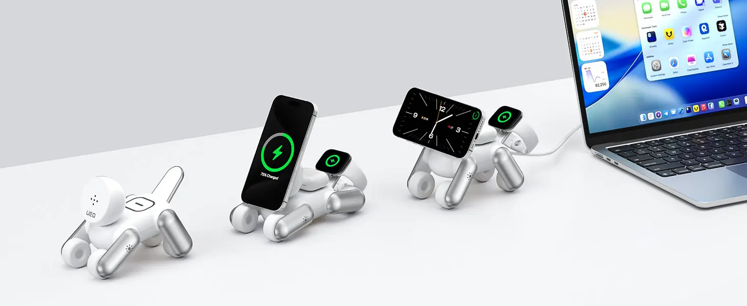 Trois chargeurs MagDog blancs alignés sur un bureau montrant les différentes positions articulées en forme de chien à côté d'un ordinateur portable