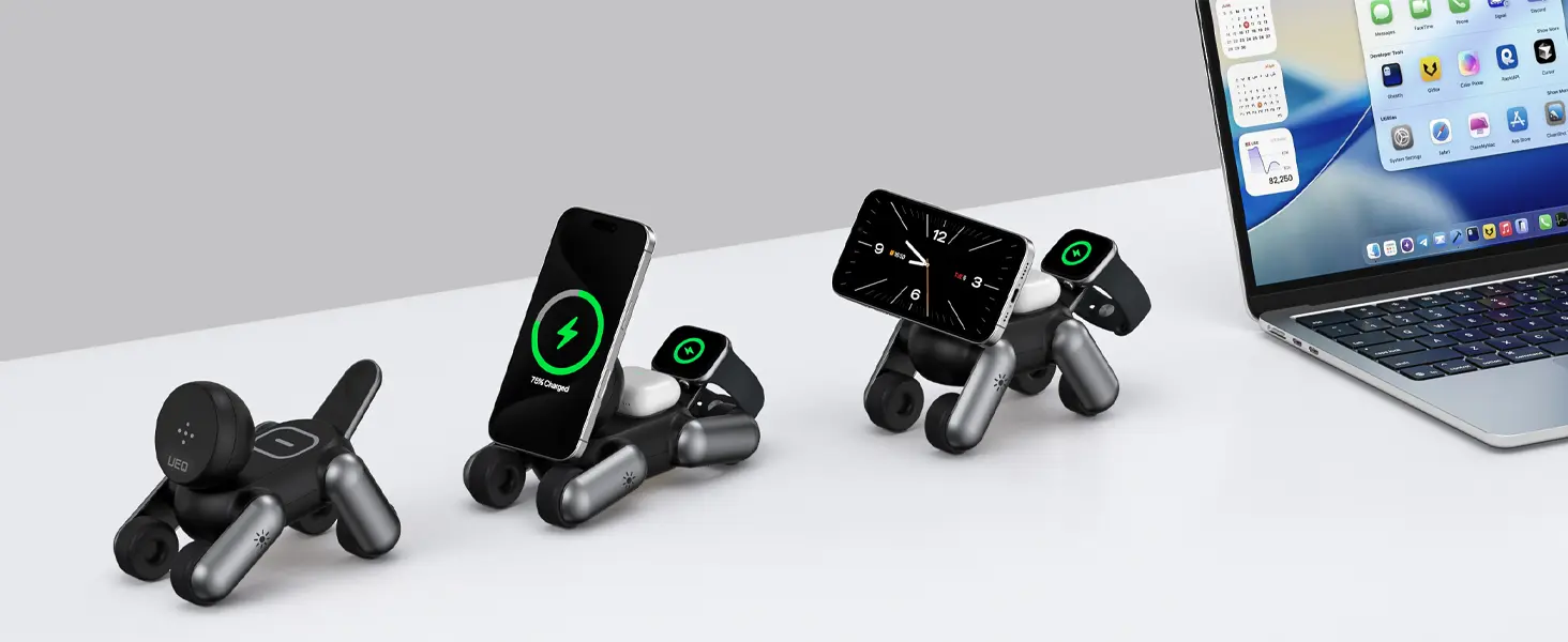 Trois chargeurs MagDog noirs alignés sur un bureau montrant les différentes positions articulées en forme de chien à côté d'un ordinateur portable